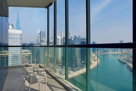 Premier King Room with Balcony | In-room safe, desk, laptop workspace, blackout drapes