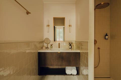 Shower, rainfall showerhead, hair dryer, towels