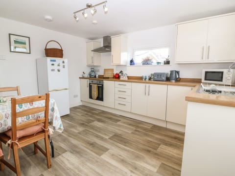 Fridge, electric kettle, toaster, cookware/dishes/utensils