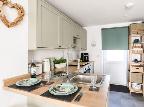 Fridge, electric kettle, toaster, cookware/dishes/utensils