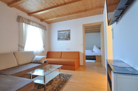 Quadruple Room | Living area | 48-inch Smart TV with satellite channels, TV, heated floors