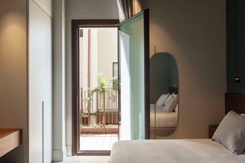 Premium bedding, down comforters, memory foam beds, minibar
