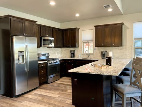 Full-size fridge, microwave, coffee/tea maker, cleaning supplies