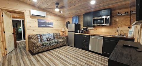 Premium Cabin, 1 Bedroom, Kitchenette | Living area | Flat-screen TV