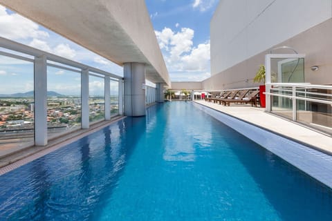 Outdoor pool, open 8:00 AM to 10:00 PM, sun loungers
