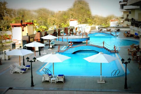 Outdoor pool, pool umbrellas, sun loungers