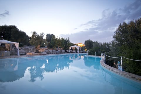Seasonal outdoor pool, open 10:00 AM to 6:00 PM, pool umbrellas