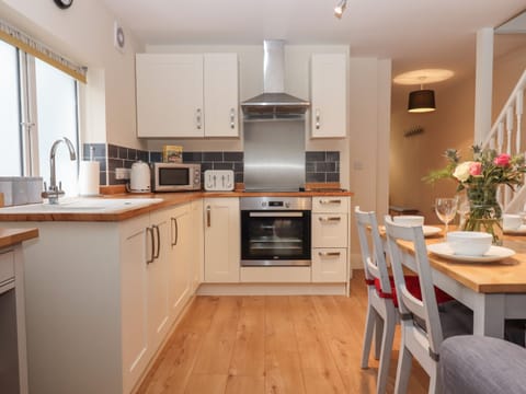 Fridge, electric kettle, toaster, cookware/dishes/utensils