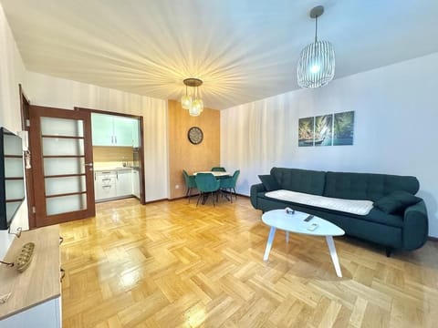 Comfort Apartment | Living area | 32-inch LCD TV with cable channels