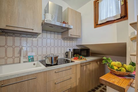 Family Apartment, Multiple Bedrooms (The Secret Garden) | Private kitchen | Fridge, microwave, stovetop, coffee/tea maker