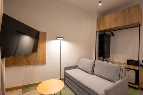 Junior Suite | Living area | 40-inch Smart TV with cable channels