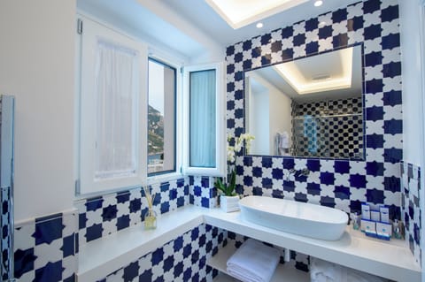Suite (Fornillo) | Bathroom | Designer toiletries, hair dryer, bathrobes, slippers