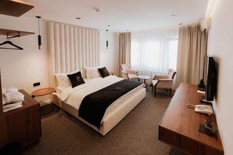 Deluxe Double Room | Minibar, individually furnished, desk, laptop workspace