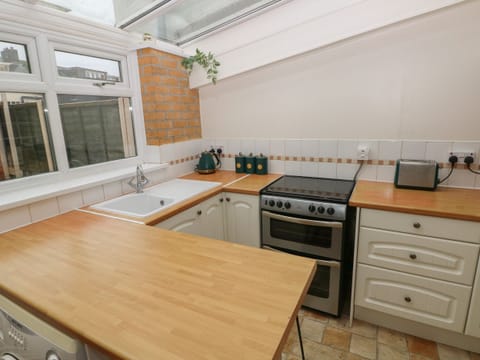 Fridge, electric kettle, toaster, cookware/dishes/utensils