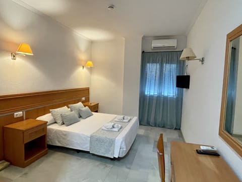 Standard Double or Twin Room | In-room safe, desk, laptop workspace, blackout drapes