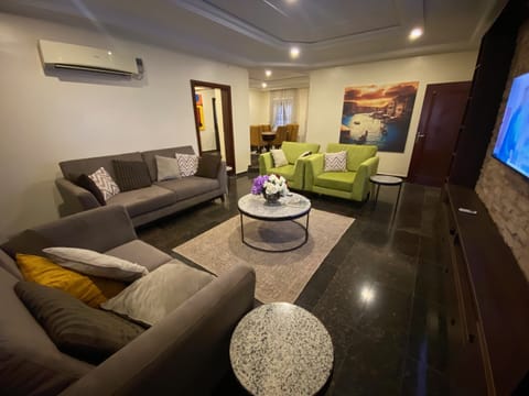 Executive Apartment, 2 Bedrooms | Living area | 42-inch plasma TV with satellite channels