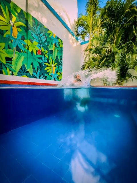 Outdoor pool, open 7:00 AM to 11:00 PM, pool umbrellas, sun loungers
