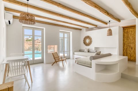 Elite Suite, 1 Bedroom | Living area | 42-inch LED TV with cable channels, fireplace, Netflix