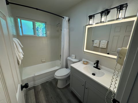 Suite, Non Smoking (Efficiency, 1 King Bed & 1 Double Bed) | Bathroom | Hair dryer, heated floors, towels