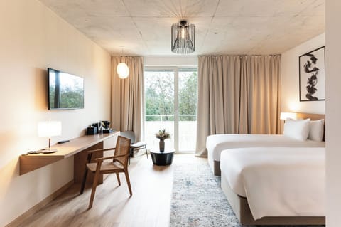 Premium bedding, down comforters, pillowtop beds, minibar