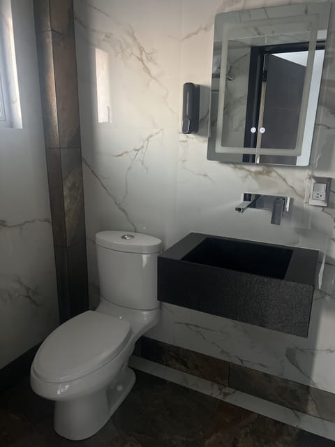 Standard Double Room | Bathroom | Shower, towels, soap, shampoo