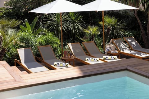 Outdoor pool, open 9:00 AM to 8:00 PM, pool umbrellas, sun loungers