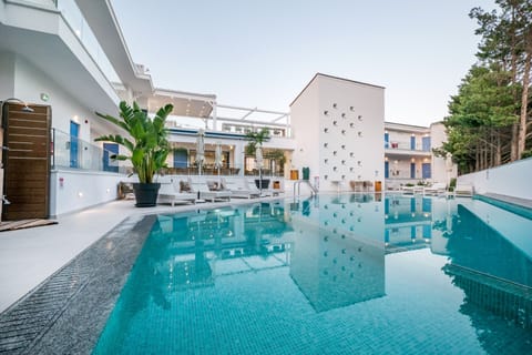 Seasonal outdoor pool, open 10:30 AM to 7:30 PM, pool umbrellas