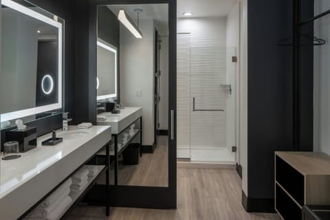 Shower, designer toiletries, hair dryer, towels