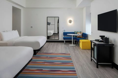 Premium bedding, pillowtop beds, laptop workspace, blackout drapes