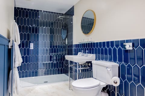 Shower, rainfall showerhead, designer toiletries, hair dryer