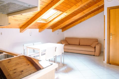 Traditional Apartment | Living area | 32-inch flat-screen TV with satellite channels