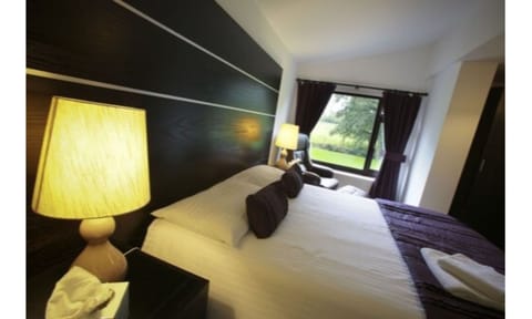 Premium bedding, Tempur-Pedic beds, desk, laptop workspace