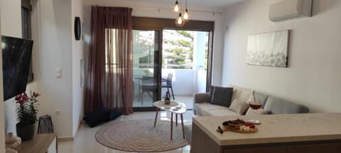 Deluxe Apartment | Living room | 42-inch Smart TV with digital channels, Netflix, streaming services