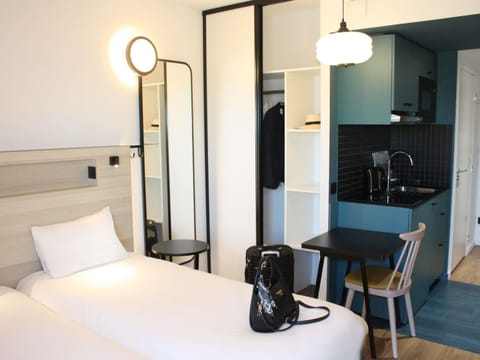 Studio (Twin Beds) | Premium bedding, blackout drapes, soundproofing