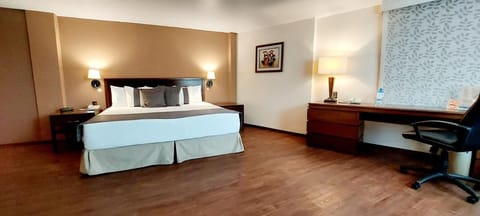 Junior Suite, 1 King Bed | In-room safe, desk, iron/ironing board, free WiFi