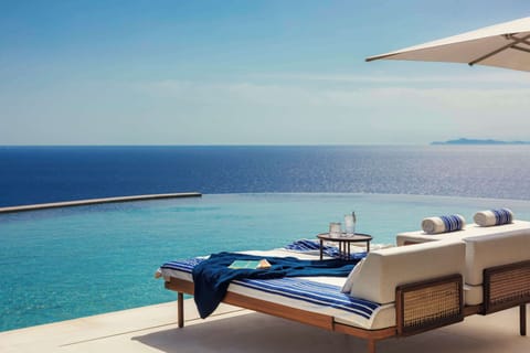 Indoor pool, 3 outdoor pools, open 11:00 AM to 7:00 PM, pool umbrellas