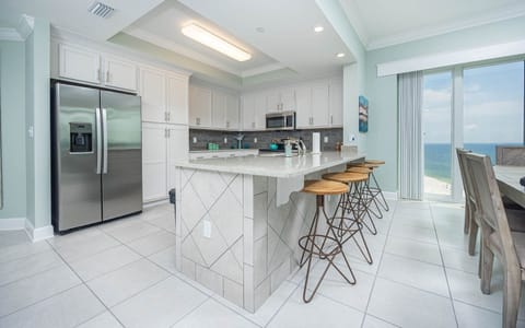 Condo, 4 Bedrooms | Private kitchen | Fridge, oven, coffee/tea maker