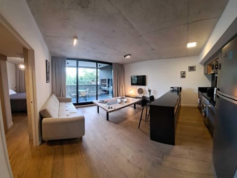 Deluxe Triple Room | Living area | 50-inch Smart TV with cable channels