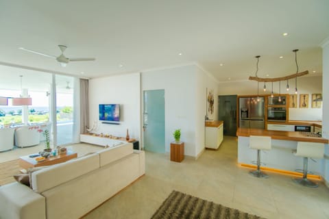 Villa | Living area | 40-inch TV with cable channels