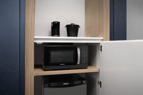 Desk, laptop workspace, iron/ironing board, free cribs/infant beds