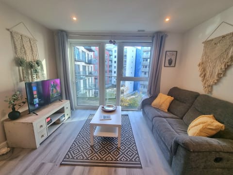 City Apartment | Living area | 50-inch Smart TV with digital channels