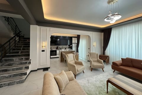 Exclusive Villa | Living room | Flat-screen TV, heated floors