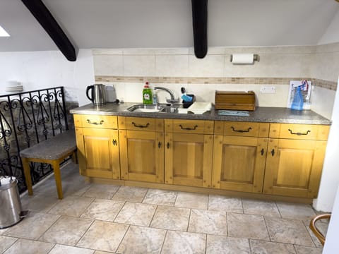 Fridge, electric kettle, toaster, cookware/dishes/utensils