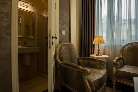 Deluxe Double Room | Living area | 50-inch Smart TV with cable channels