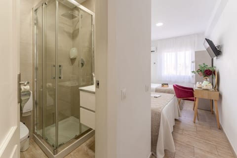 Double Room, Multiple Beds | Bathroom | Shower, towels, soap, shampoo