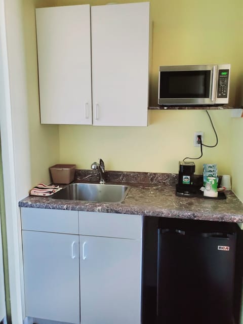 Family Suite, Multiple Beds, Garden View | Private kitchen | Mini-fridge, microwave, coffee/tea maker