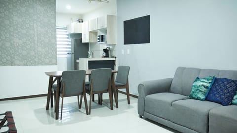 Family Apartment, 3 Bedrooms | Living area | 42-inch Smart TV with cable channels, Netflix, iPod dock