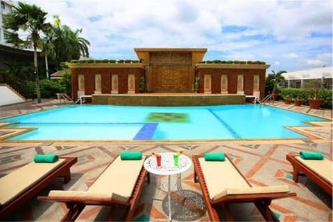 Outdoor pool, pool umbrellas, sun loungers