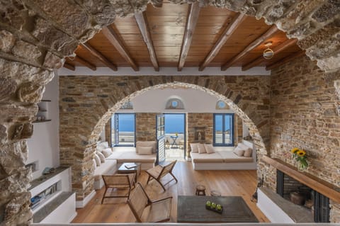 Villa, 2 Bedrooms | Living area | 48-inch flat-screen TV with cable channels, fireplace, books