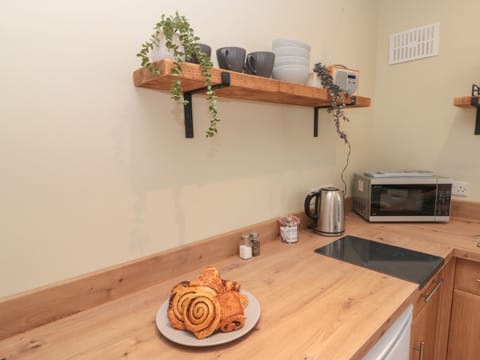 Fridge, electric kettle, cookware/dishes/utensils